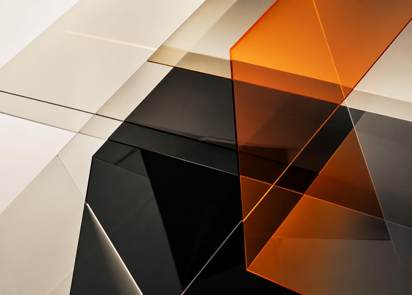 Overlapping translucent black, cream and amber panels arranged as distinct protective layers